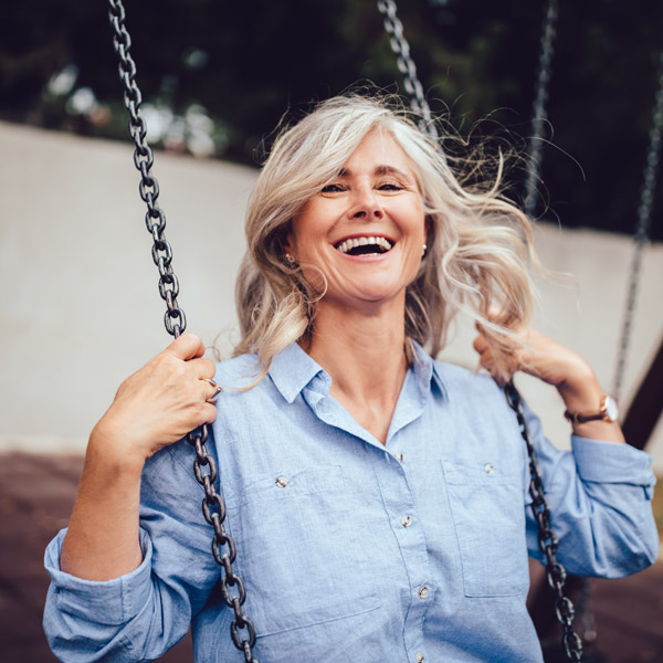 older woman swinging