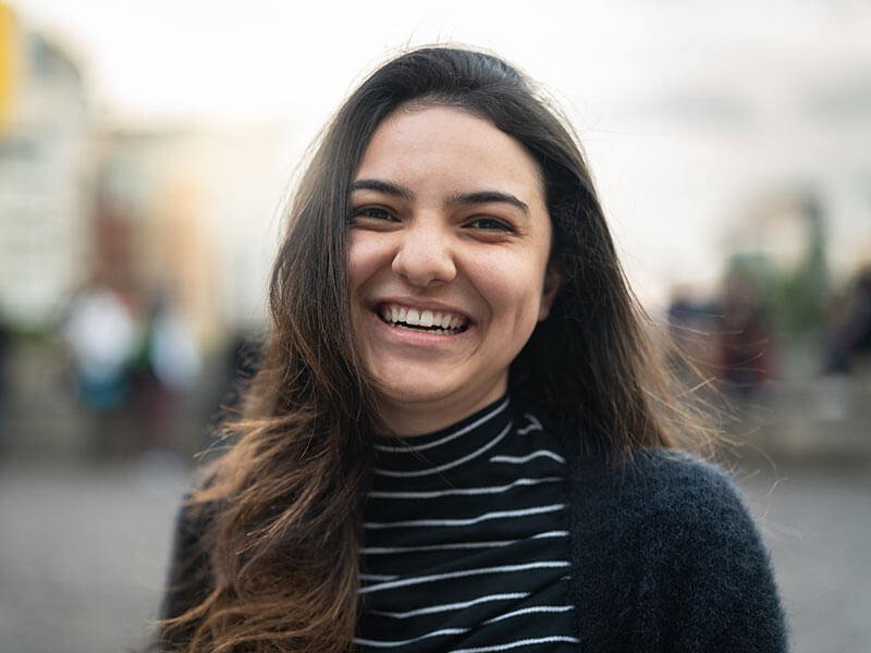 woman smiling outdoors