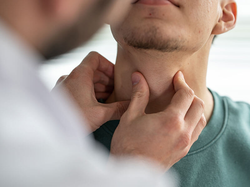 man being examined by doctor