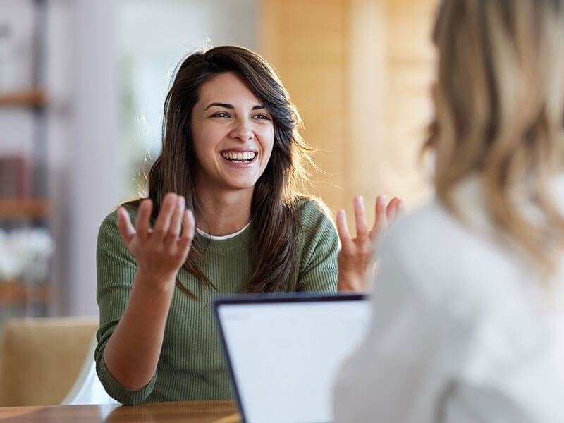 woman smiling at consultation with doctor