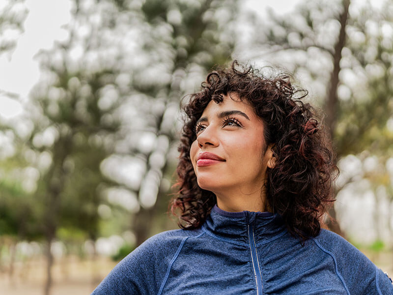 woman smiling outdoors