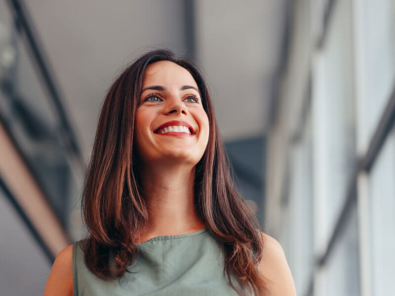 woman smiling inside office