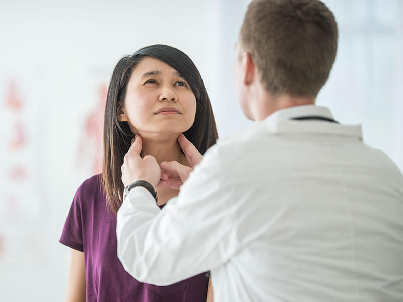 woman being examined by doctor