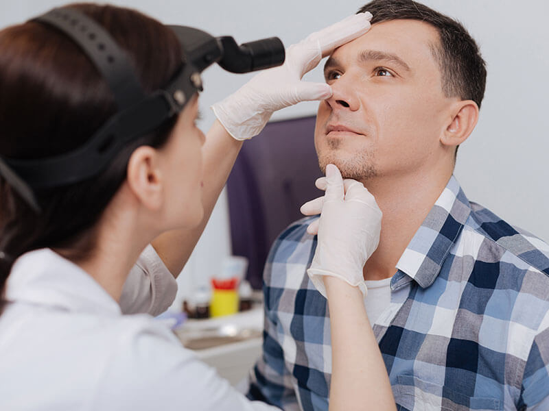 man being examined by doctor